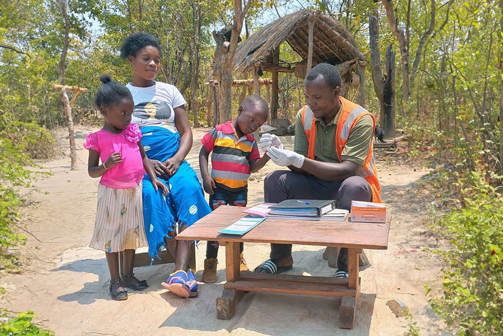 A child and his family receiving a medical checkup.