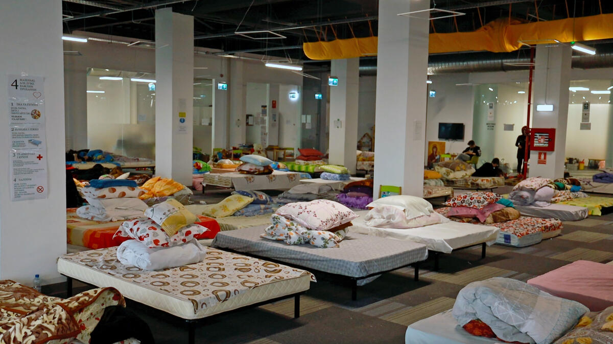 In 2022, this large room filled with beds and bedding waited for Ukrainian refugees to arrive in Romania.