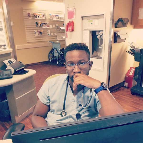 Tolu during a shift at the hospital where he practices