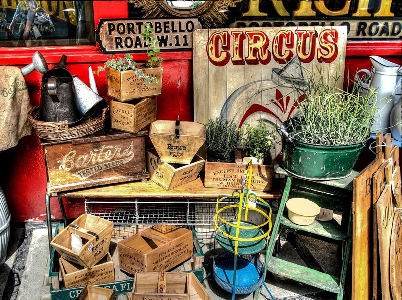 An assortment of vintage wooden boxes and signs.