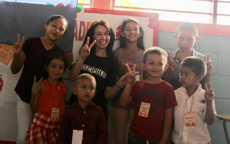 Carolyn Burton with a group of World Vision sponsored children