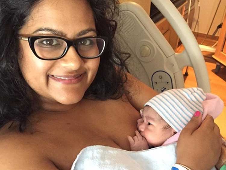 Writer Alicia breastfeeding newborn Annalise.