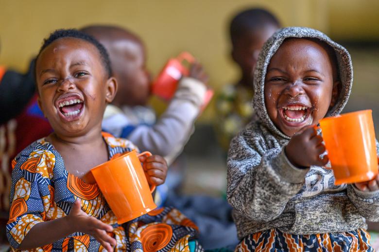 Children enjoy the nutritious porridge served to them at an early childhood development centre operated by World Vision in Rwanda.