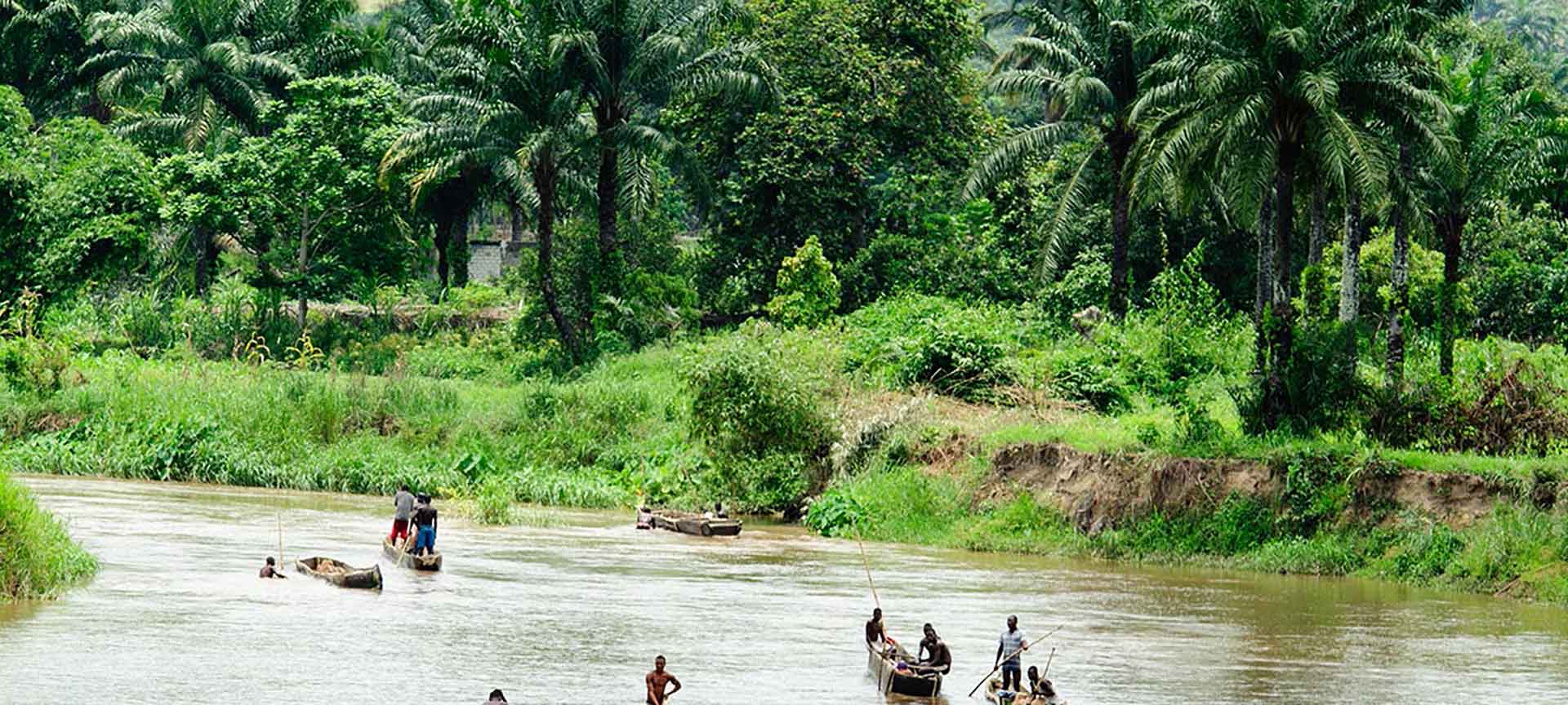River with men in boats in the Democratic Republic of Congo