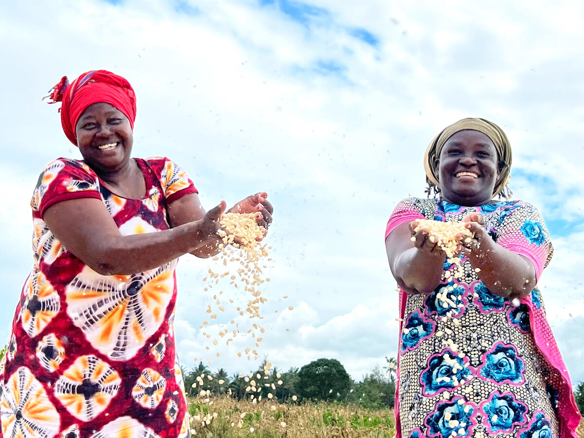 Two female business owners smiling with their crop.