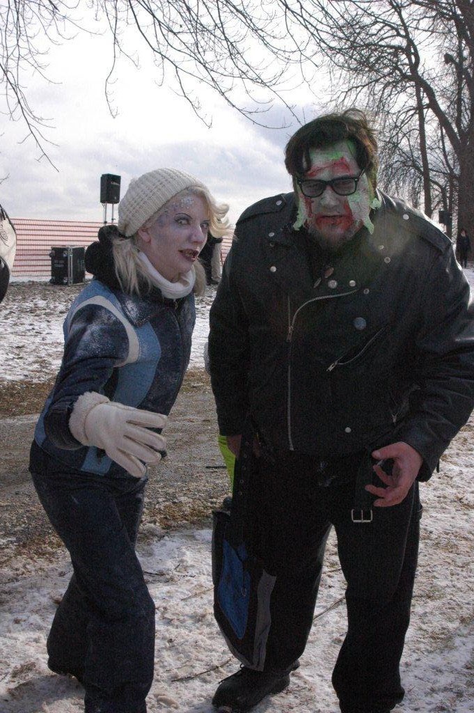 A woman and a man with zombie costumes