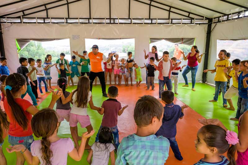 Venezuelan children dance and play at a World Vision child friendly space.