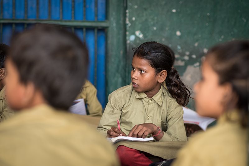 Sponsored child Varsha, 11, attends school in an open-air classroom in India. Her family’s poverty and cultural traditions form a combination ripe for child marriage. But with every year Varsha stays in school, she’s less likely to marry early – like her mother did.