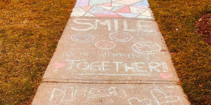 colourful chalk drawings on a sidewalk