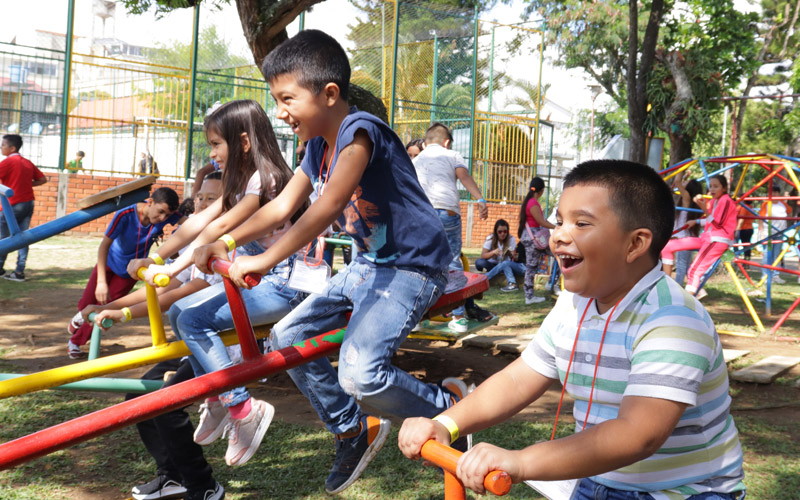 Children in Colombia play on a playground.