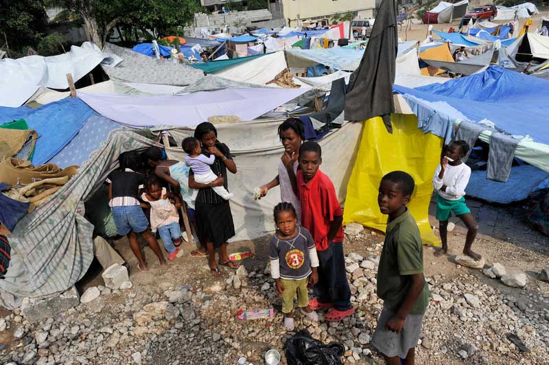 Mothers and children at a camp for displaced people in the aftermath of the earthquake that hit Haiti in 2010.