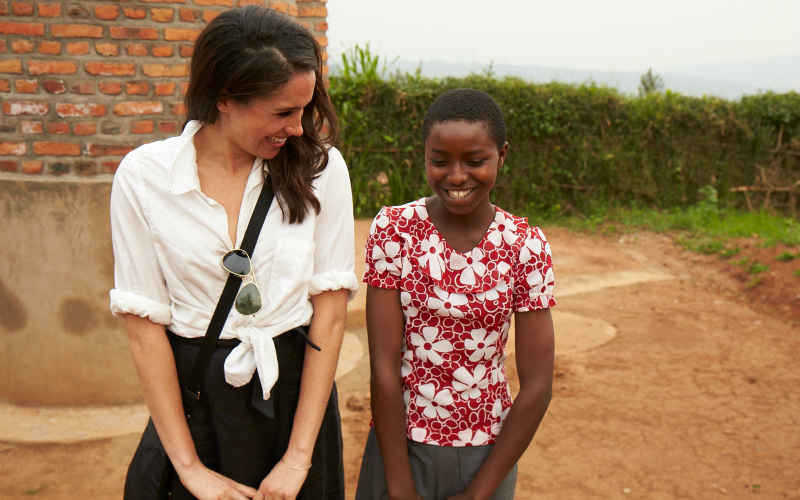 Meghan and a girl in Rwanda smiling