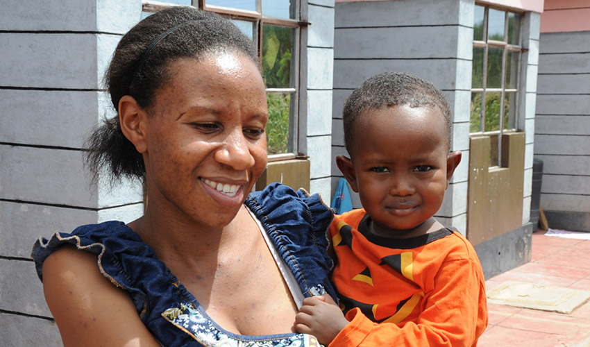 A Kenyan woman holding her child