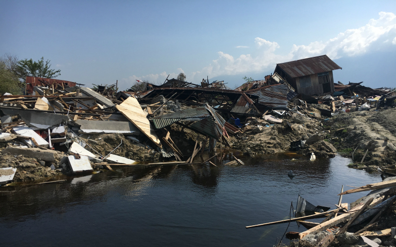 Destroyed homes still partially submerged in Palu, Indonesia