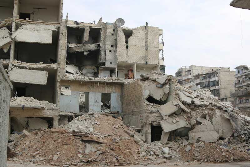 Apartment buildings ruins in Aleppo, Syria.