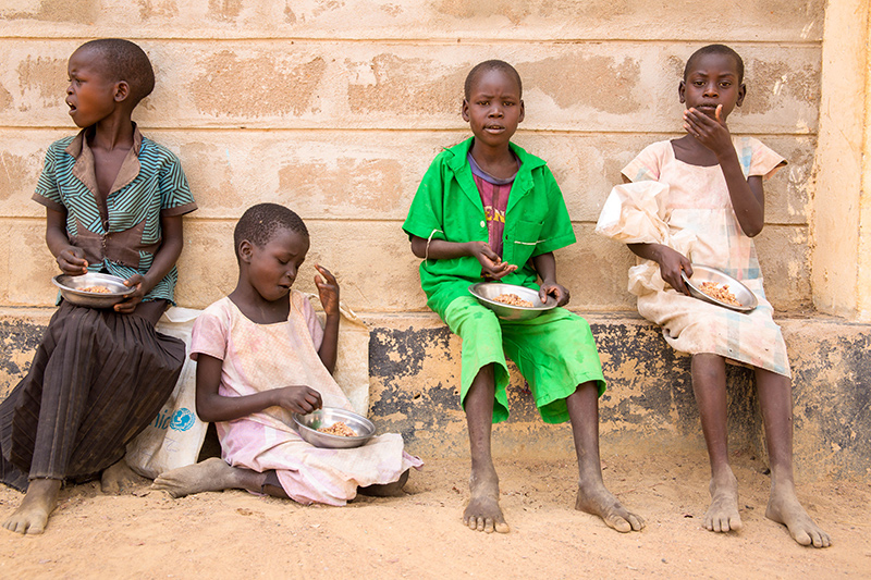 Children are fed sorghum and beans at school.