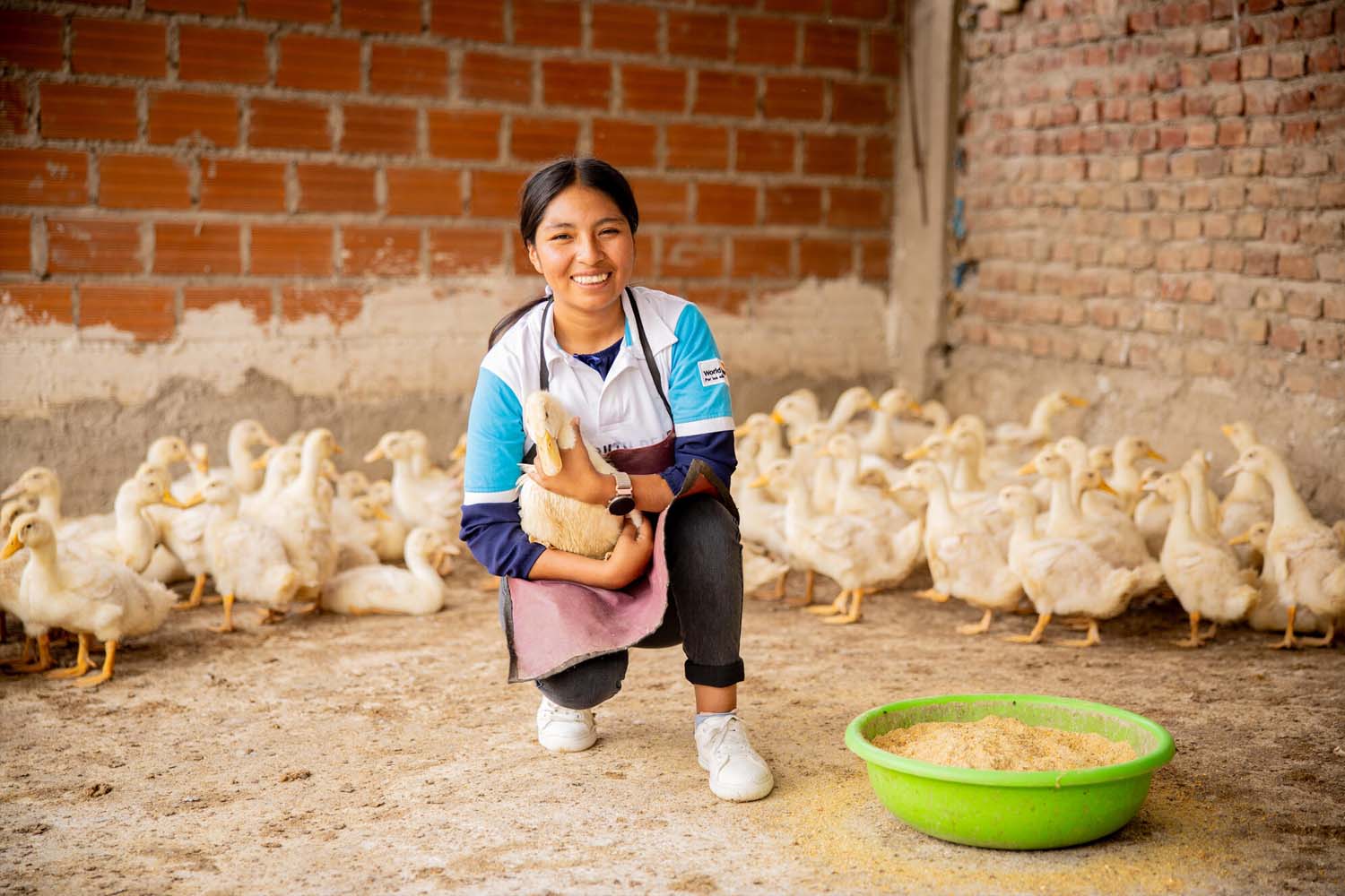 Youth Ready graduate Ana holding one of the ducks from her small business
