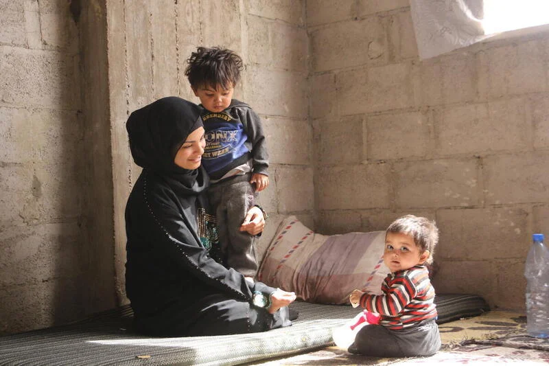 Shaima* and her children after receiving the nutrition kits.
World Vision Syria Response partner, Action For Humanity