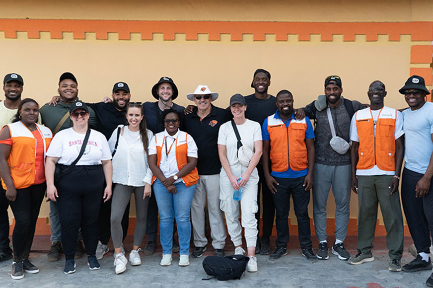 Lokombo (left-second row) and fellow World Vision Canada player ambassadors join World Vision staff for a photo in Nairobi. (Kenya, 2024)