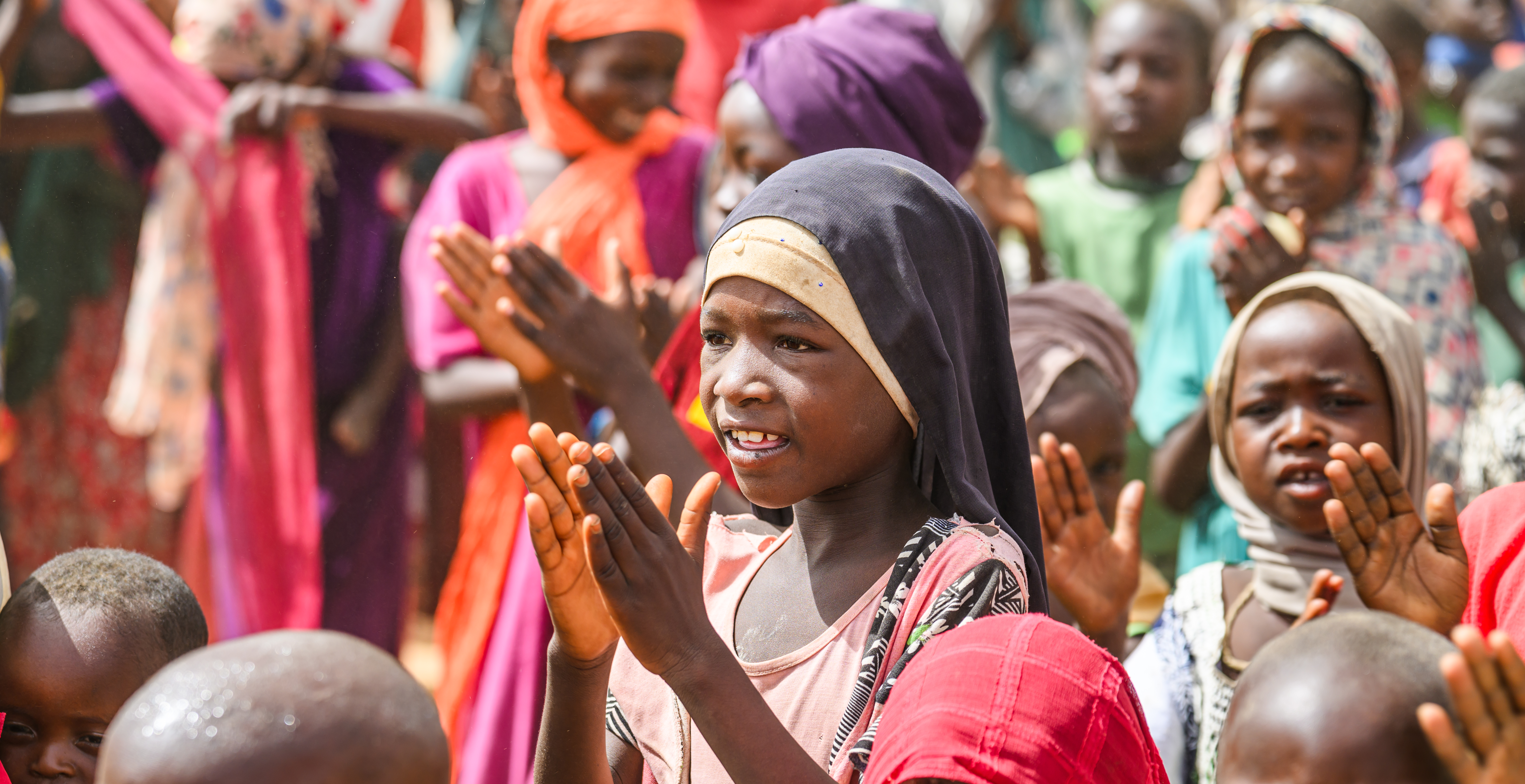 Sudanese refugee children sing a song at the Child Friendly Space in Mile Refugee Camp, Guerera, Chad.