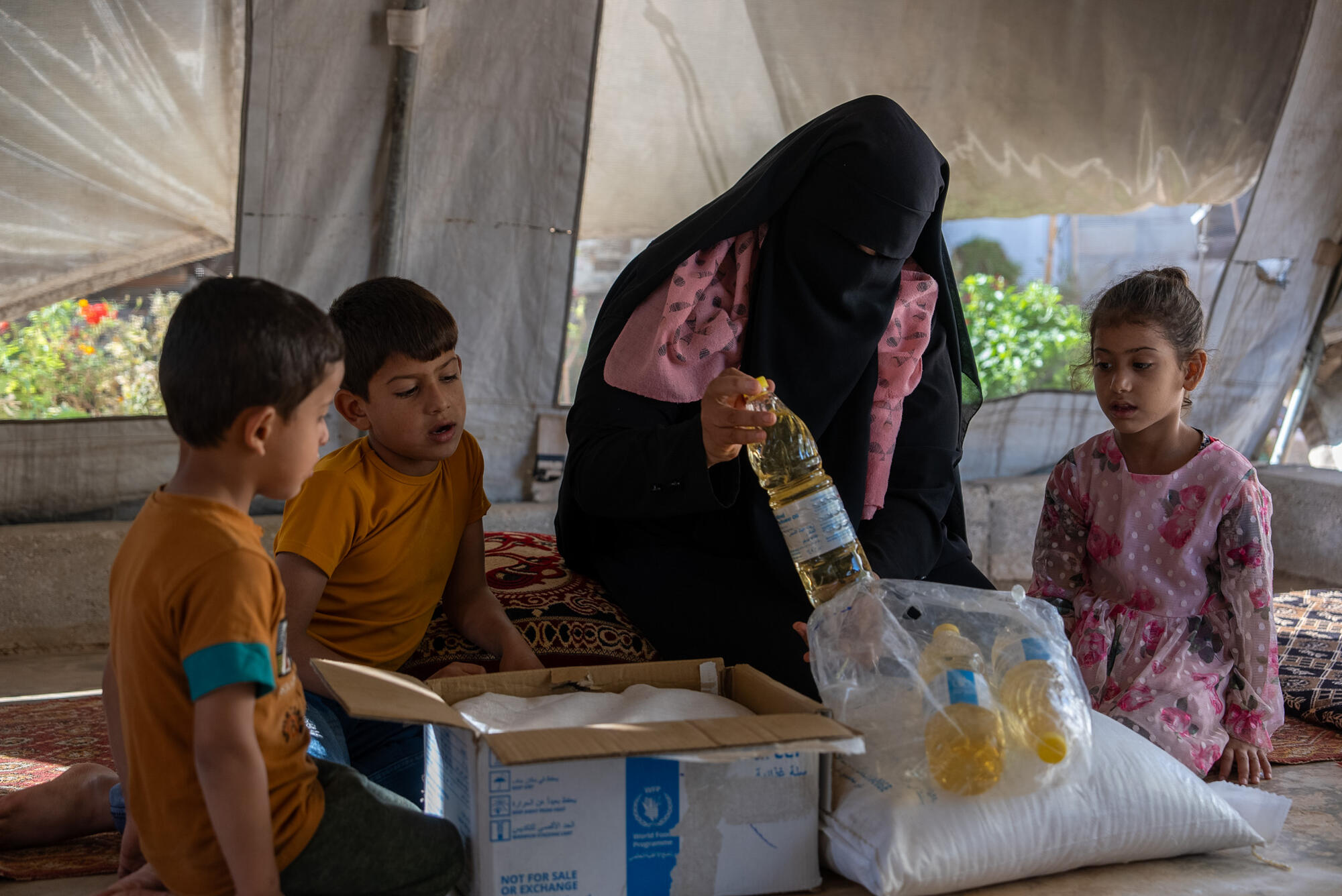 “This support means the world to me and my children,” says Um Muhammad. She and her seven children have been living in a tent at a refugee camp in Northwestern Syria for seven years.  