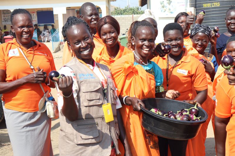 A Mother-to-Mother group from Rock City, South Sudan, shows off the bounty from its harvest. World Vision Hong Kong helped kick off the project in 2016 and was joined by UNICEF in 2020. There are 15 such groups in Juba County, each consisting of 15 mothers.