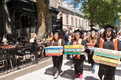 girls march along the street carrying political placards